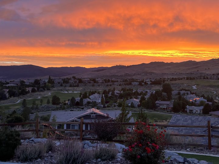 A gold and orange sky over Somersett's fairways and homes.
